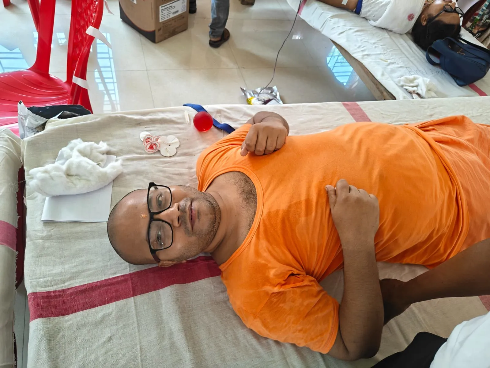 A monk giving blood at the camp