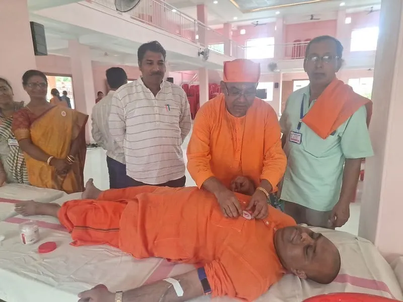 A donor being prepared at the blood donation camp