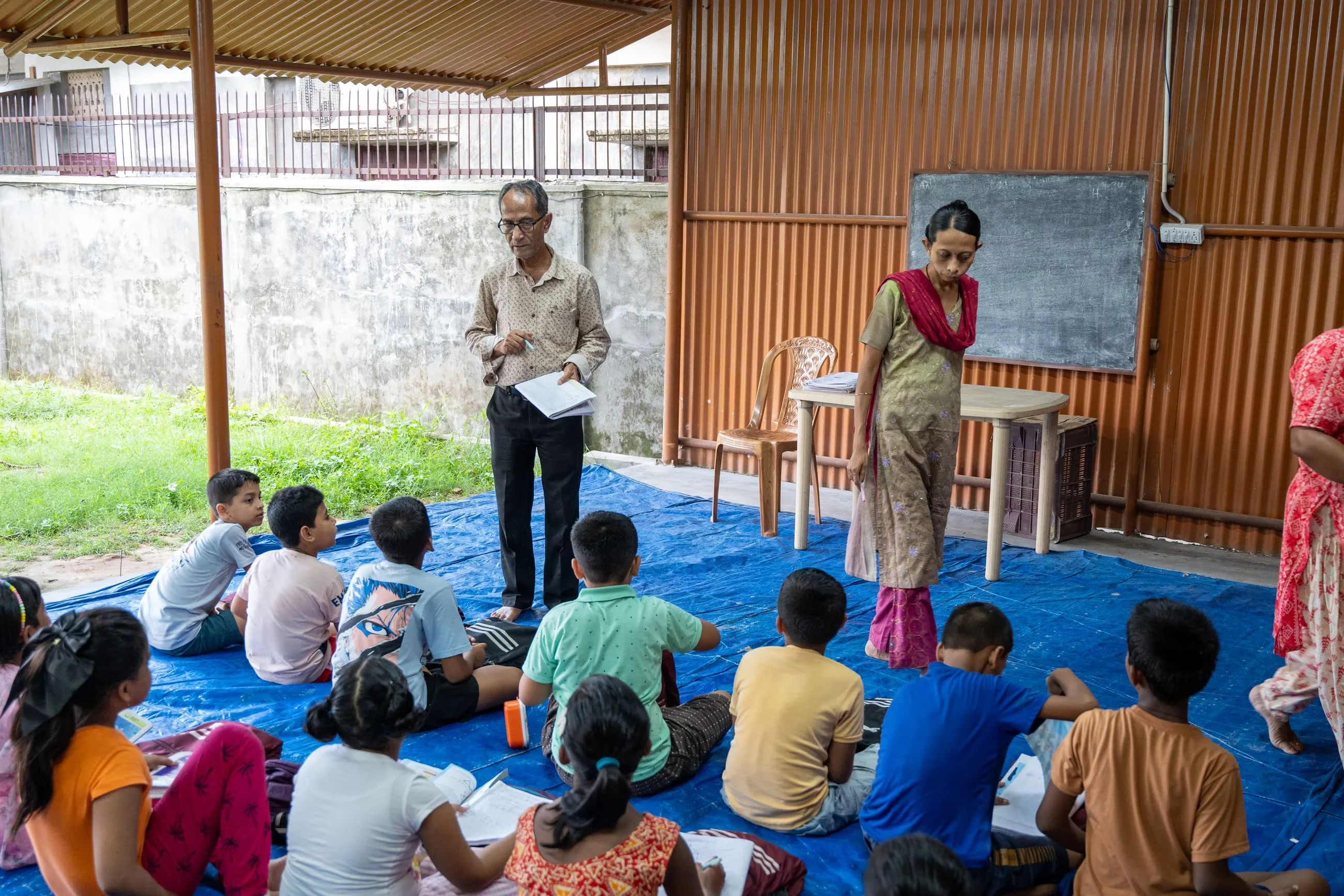 A teacher taking a class at the free coaching centre