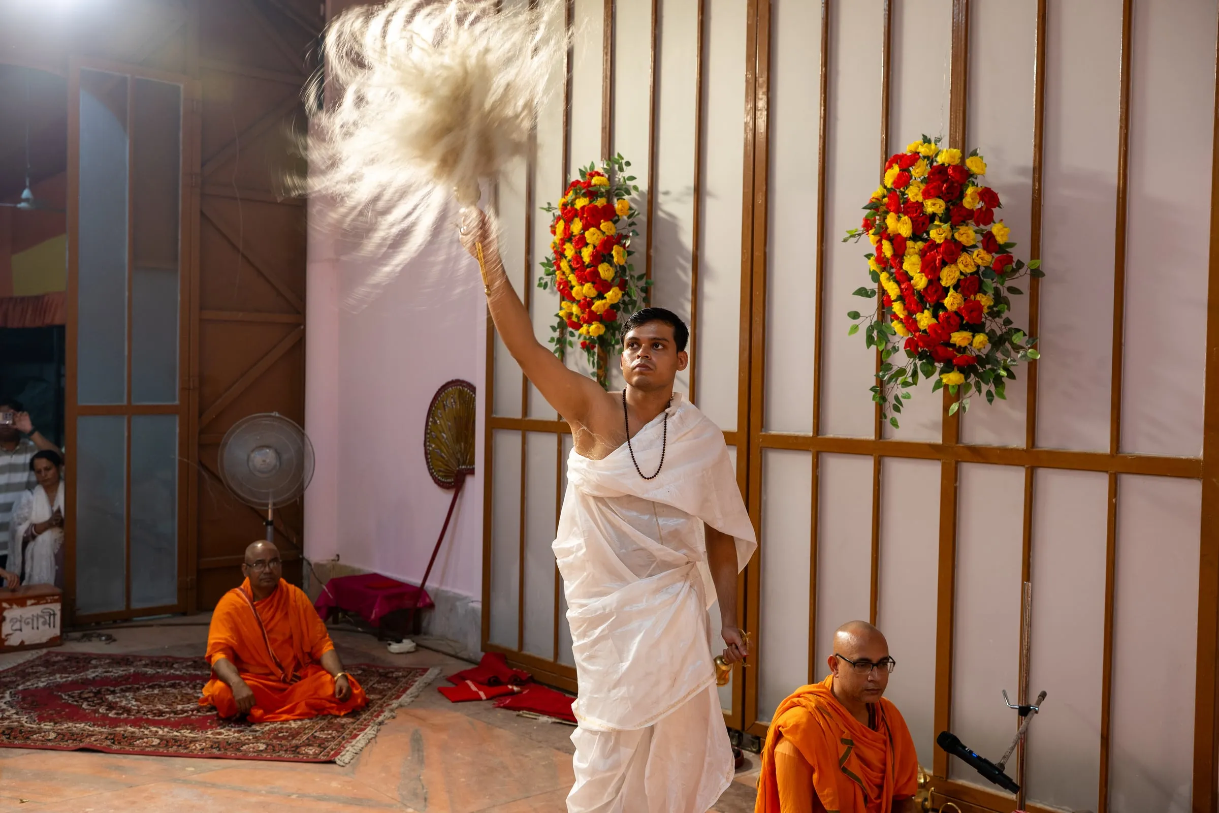 The chamara being waved during the Durga Puja arati