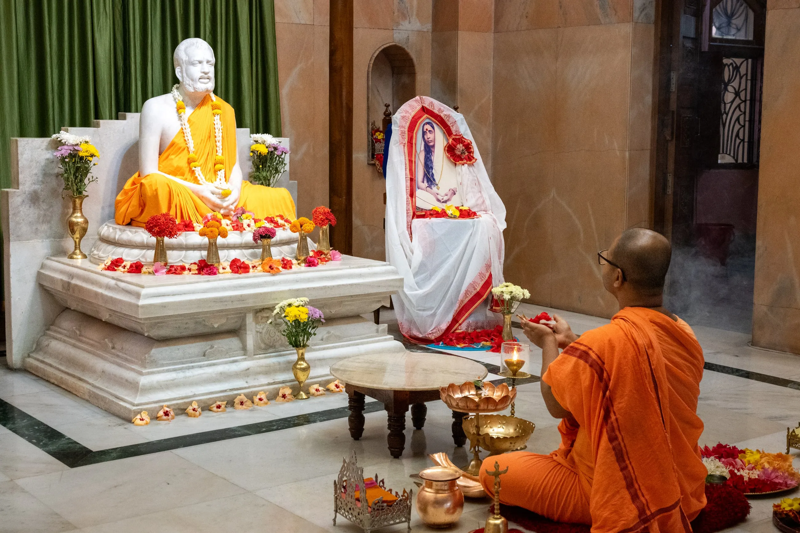 An offering being made before the image of Sri Ramakrishna