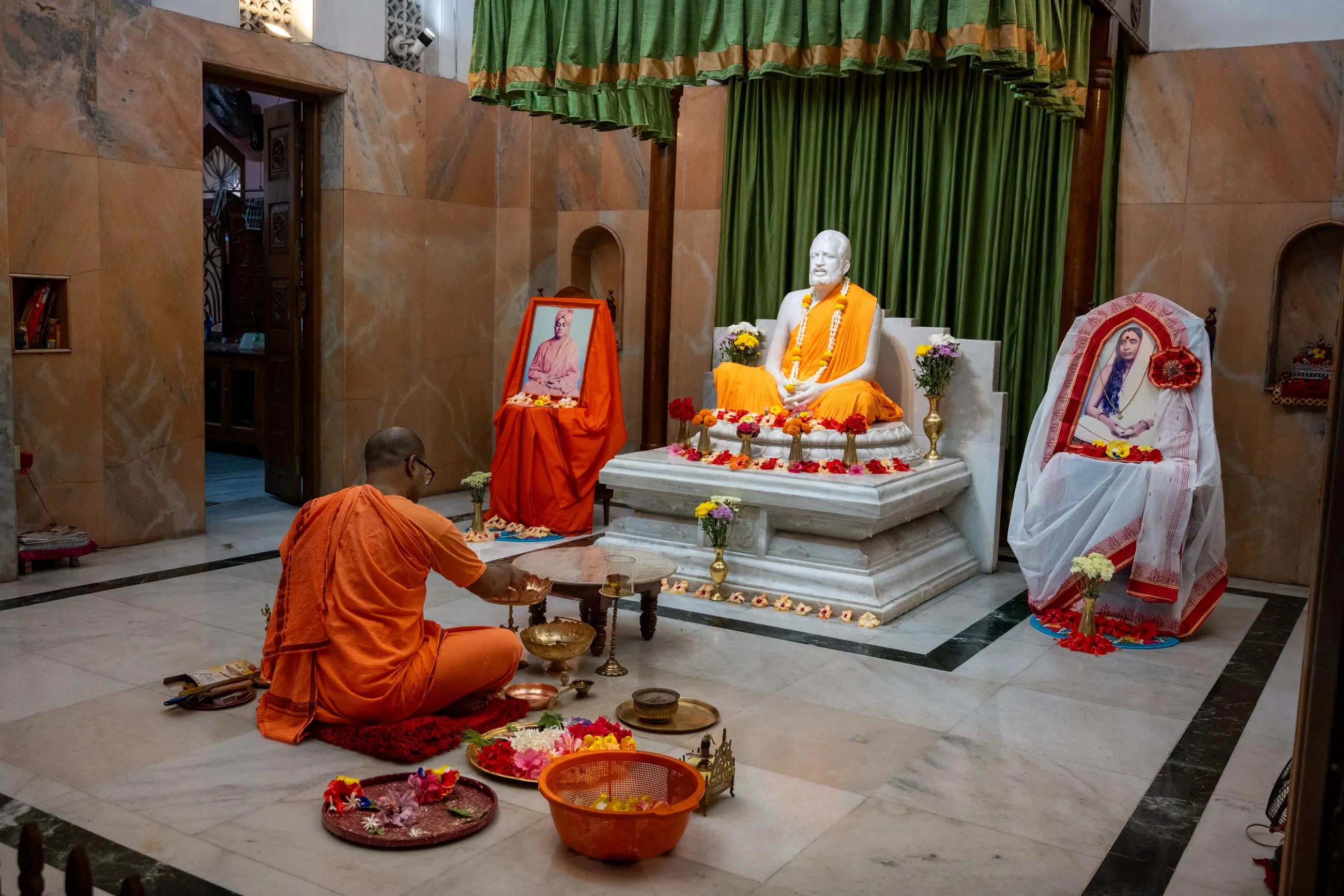 A monk performing the daily worship in the shrine