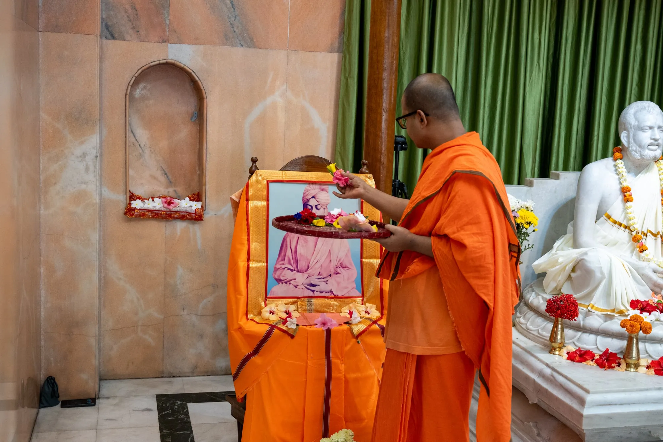 Flowers offered to the portrait of Swami Vivekananda
