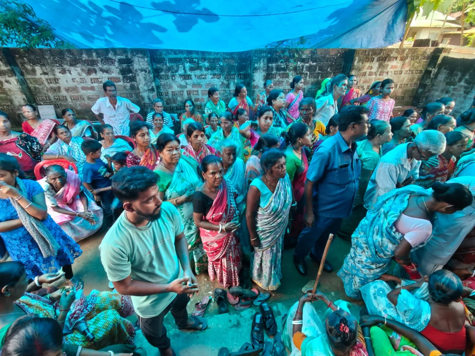 People waiting at a relief distribution