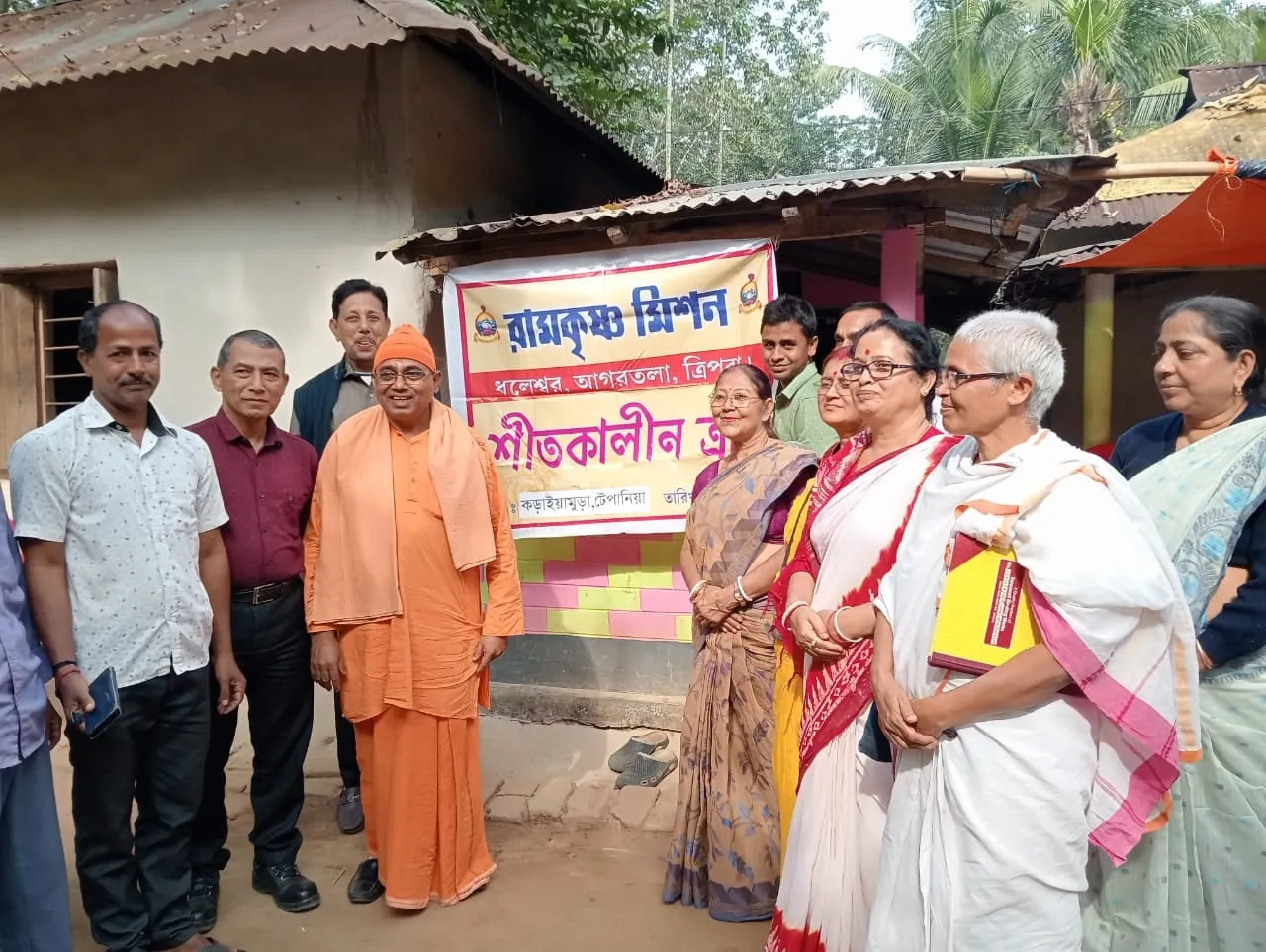 Winter relief being distributed at a village, under the Mission’s banner