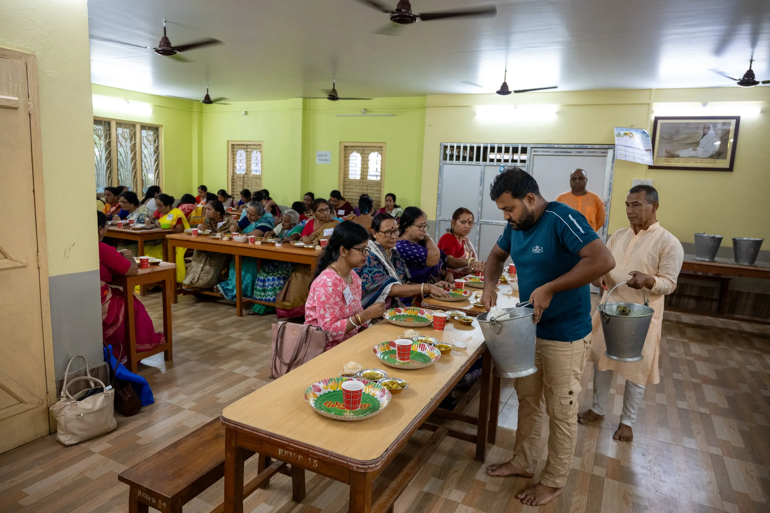 Delegates being served a meal at Bhakta Sammelan