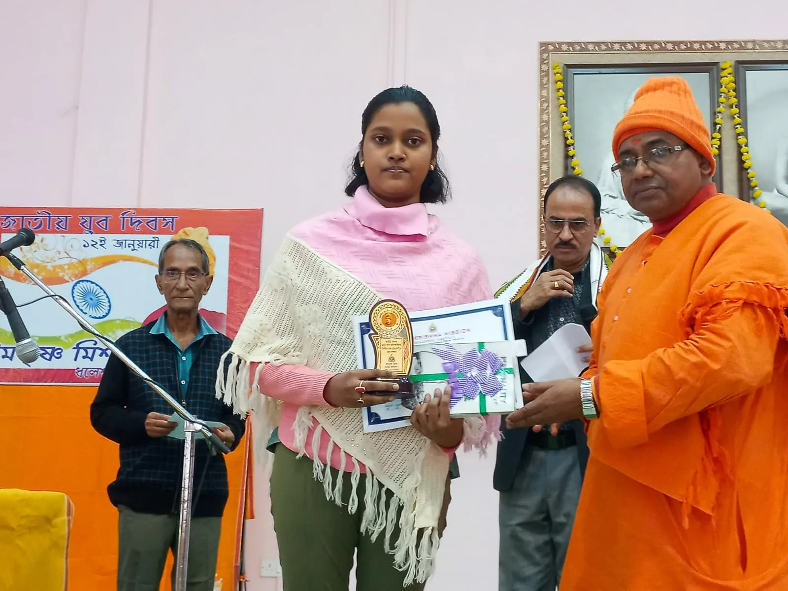 A student receiving a prize on National Youth Day